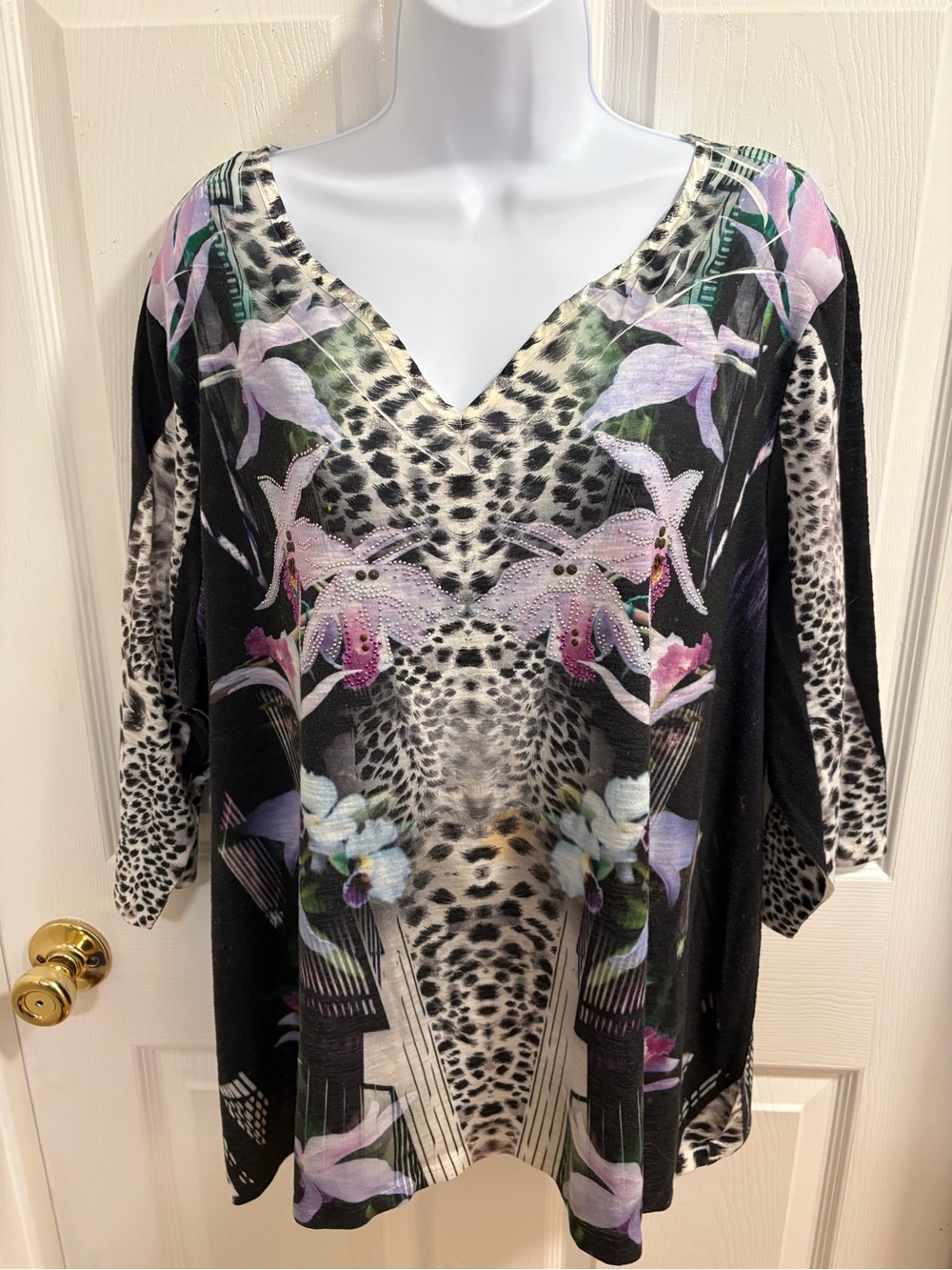 French Blue floral and animal print top. Hidden animal faces in the fabric